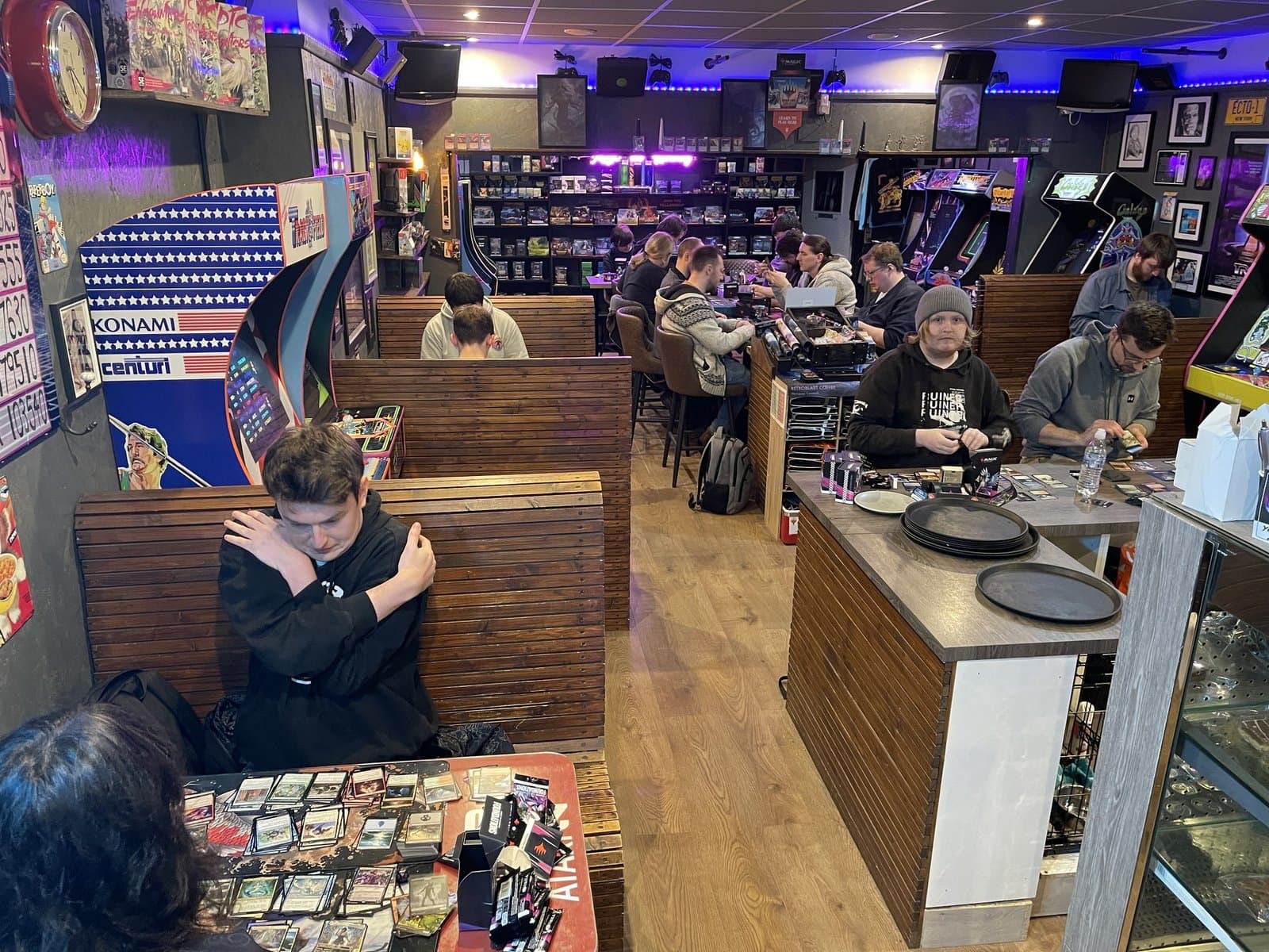 Saturday afternoon — booths full of customers playing tabletop games across the venue