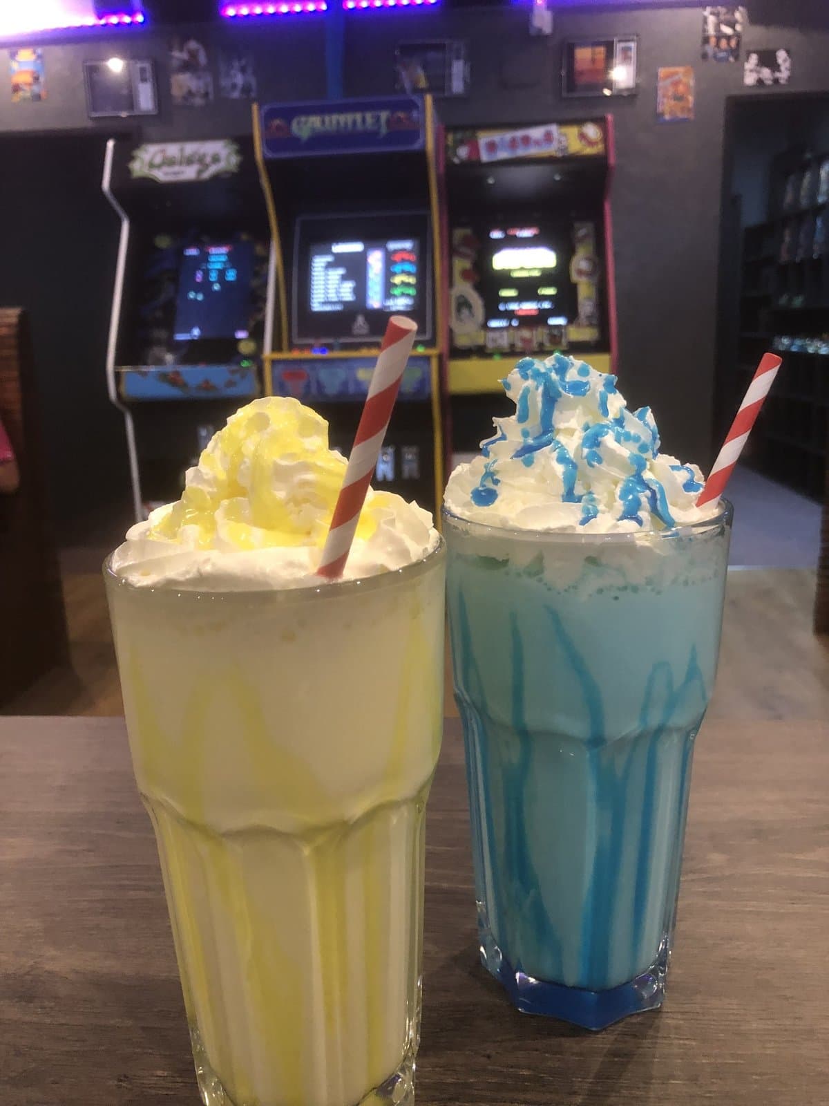Bubblegum and lemon milkshakes in front of Galaga, Gauntlet and Pac-Man cabinets